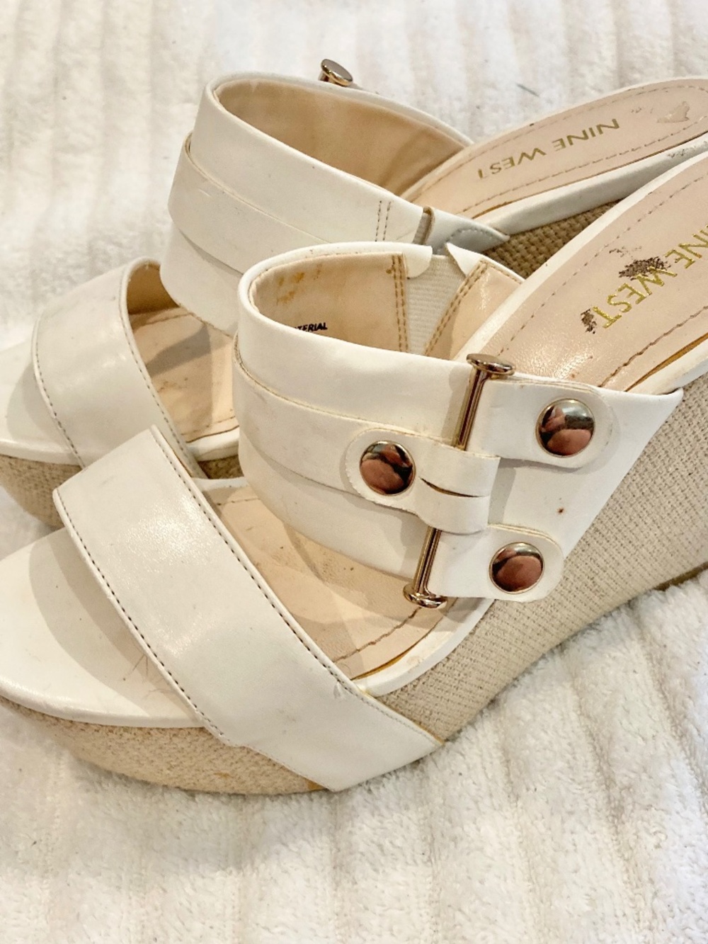 Nine West White wedges with gold buckle accentsFeaturing contrasting, gold acce